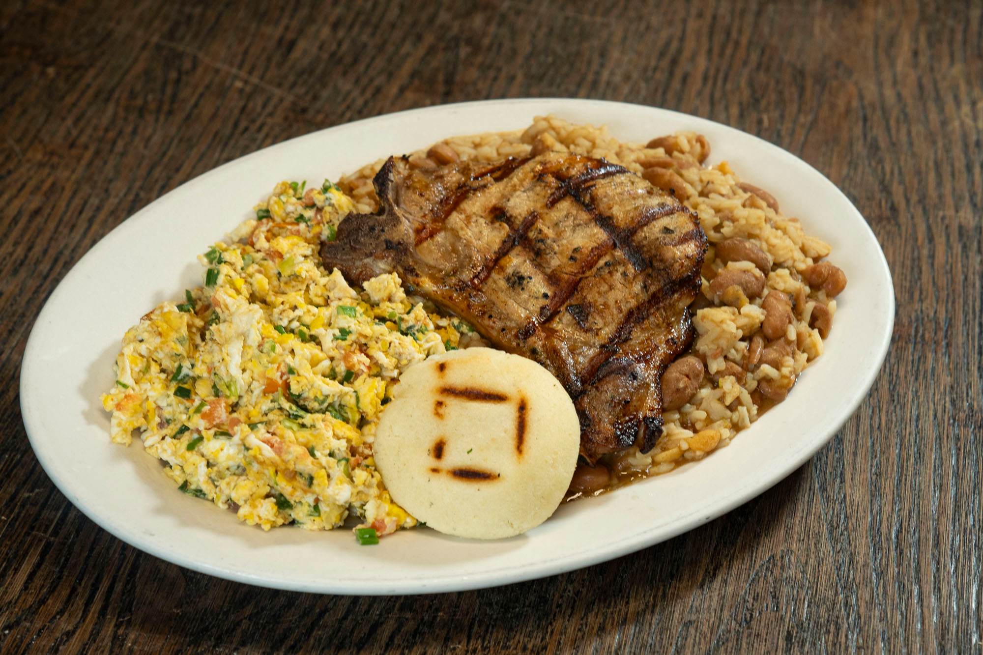 Calentado Con Chuleta Huevos Al Gusto, as photographed for the restaurant's online menu.